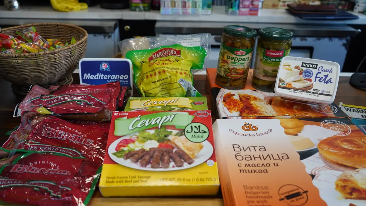 Balkan groceries at WYN MKT: frozen ćevapi, Bende smoked sausage, Podravka peppers and pickles, feta and banitsa