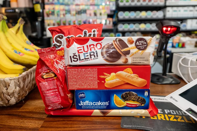 Euro Išleri and Jaffa cakes stacked on the WYN MKT counter
