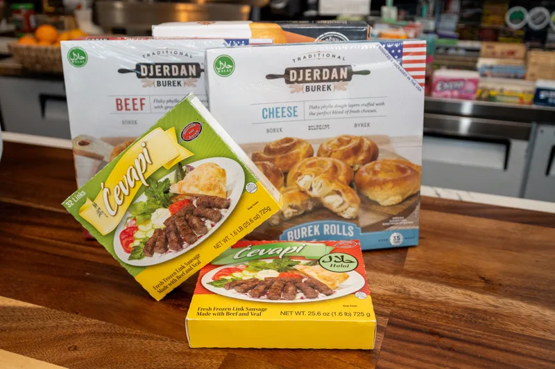 Djerdan burek boxes with two boxes of frozen ćevapi on the WYN MKT counter