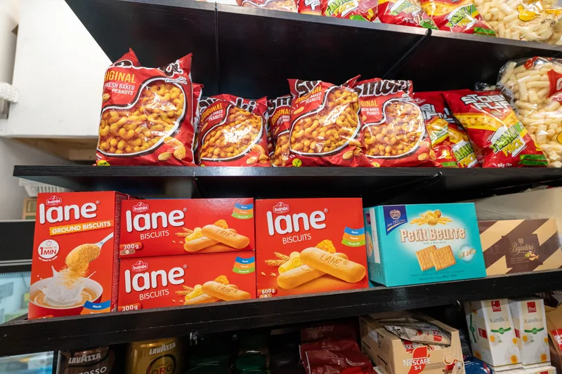 Bags of Smoki with boxes of Lane biscuits and Petit Beurre on the shelf