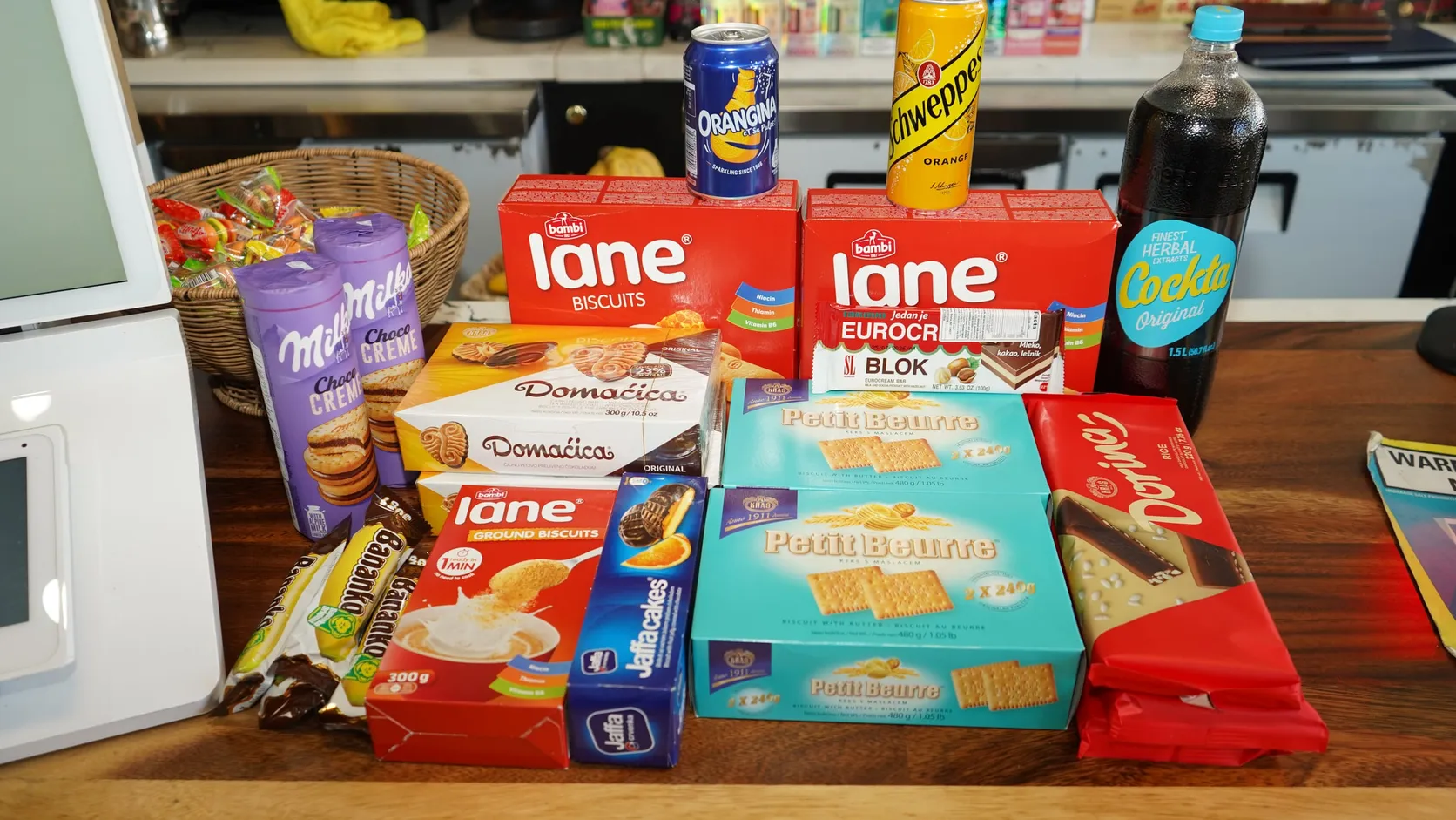 Eastern European groceries at WYN MKT in Miami: Lane biscuits, Domaćica, Petit Beurre, Dorina, Eurocrem Blok, Jaffa cakes, Bananko and Cockta
