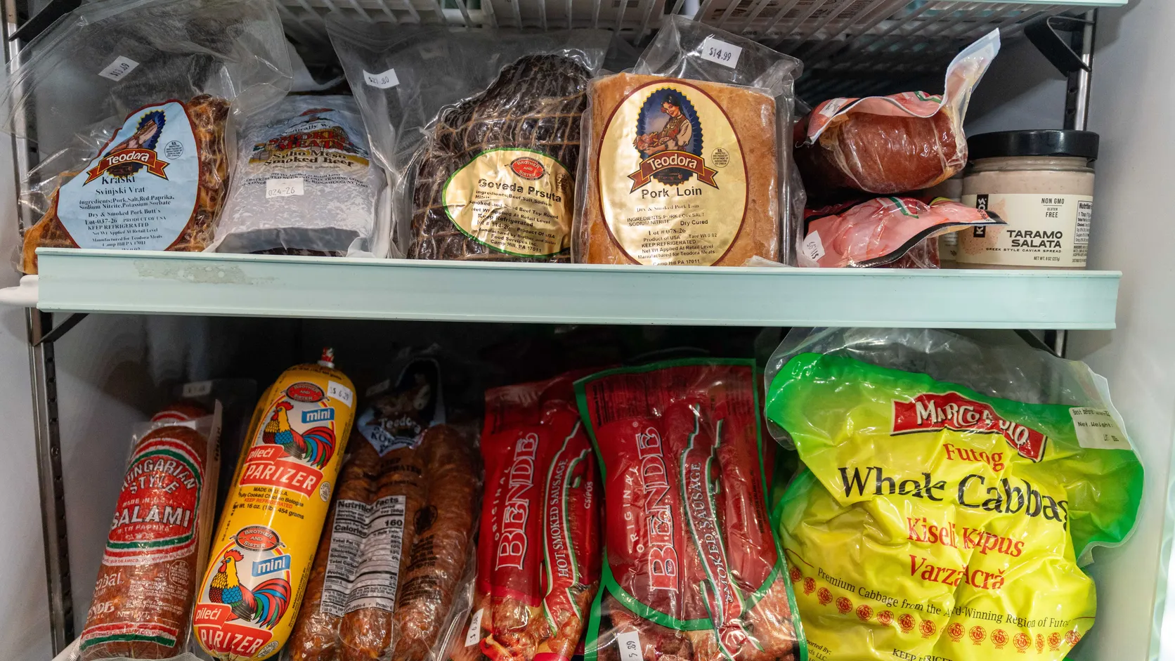 Teodora smoked meats, salami, parizer and Bende sausage in the WYN MKT deli fridge