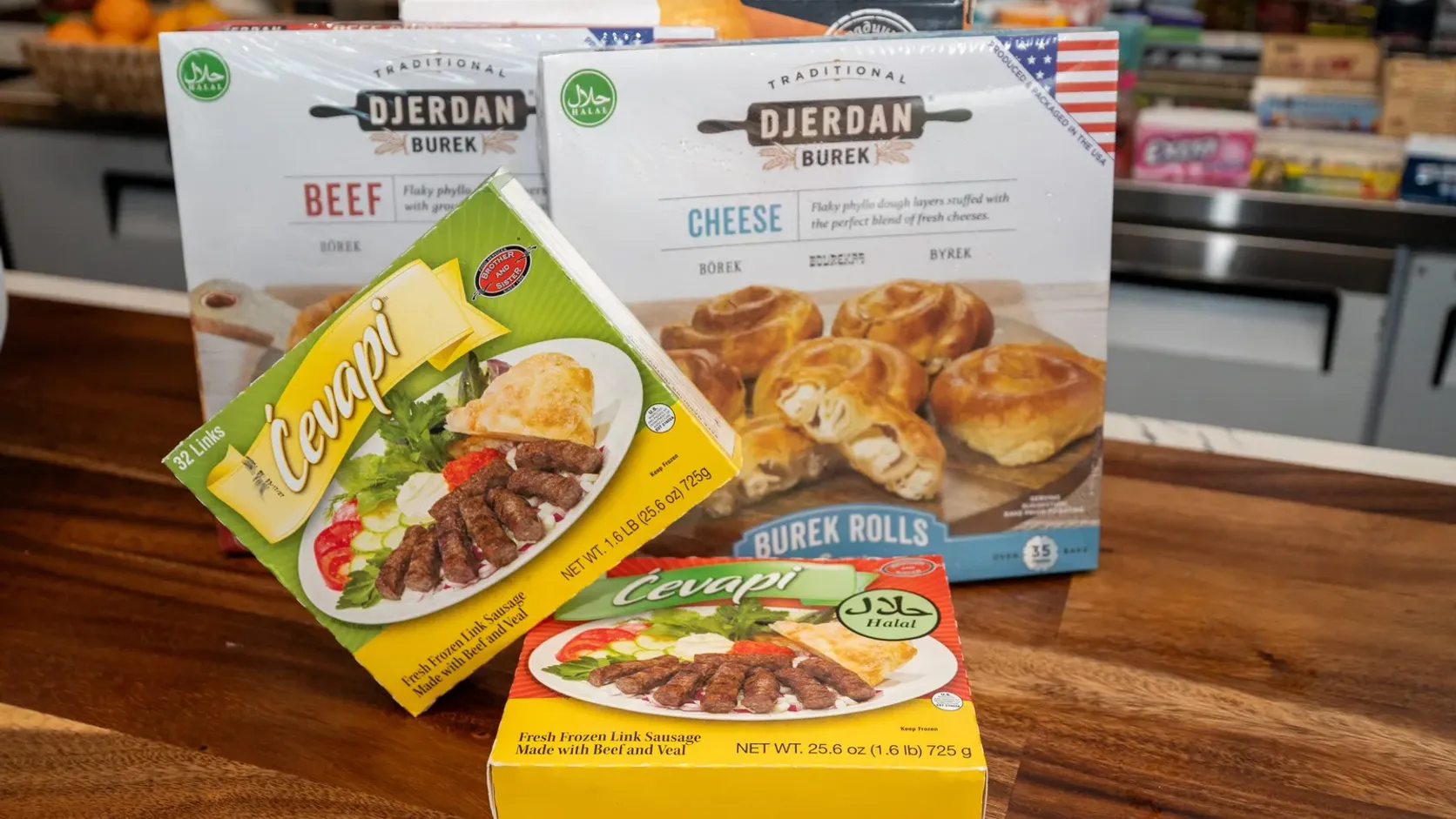 Djerdan beef and cheese burek with two boxes of frozen ćevapi on the WYN MKT counter